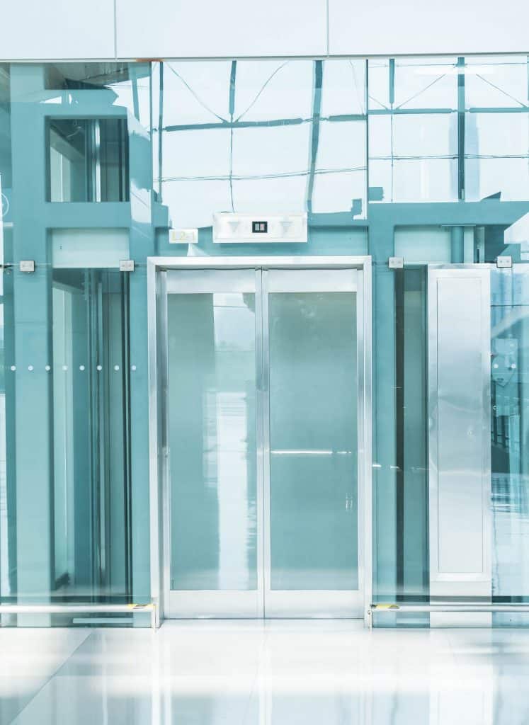 Transparent elevator in underground passage Transparent elevator in underground passage - blue white balance processing